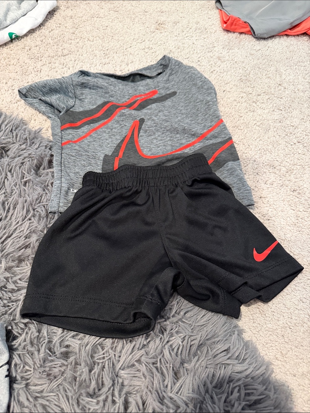 Nike Black Kids Athletic Shorts with Red Swoosh